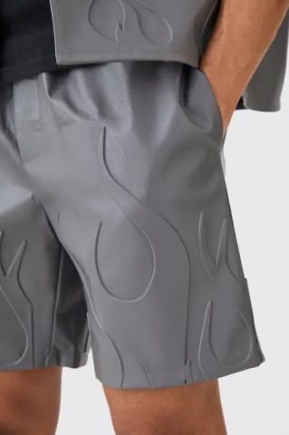 Pantalon estampado llamas relieve GRIS